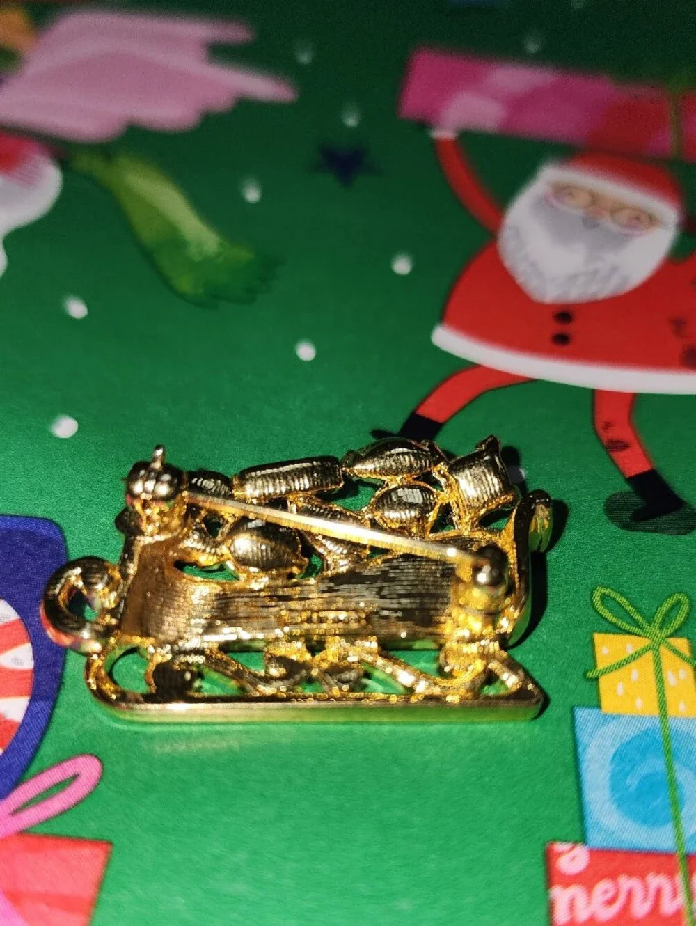 Monet Gold-tone Festive Sleigh Brooch with Multicolor Rhinestones